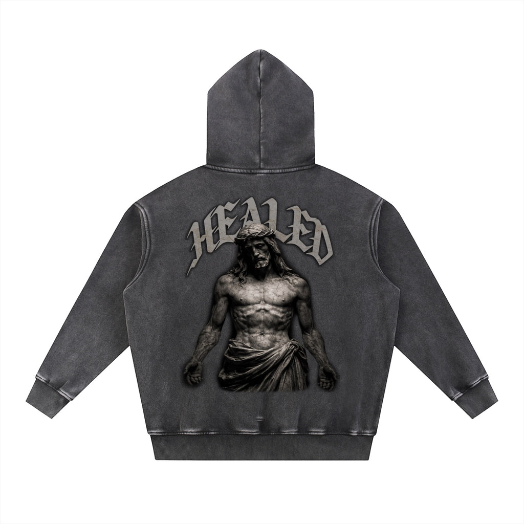 Foundation HEALED oversized charcoal grey washed cotton blend hoodie with Jesus graphic and text on back.