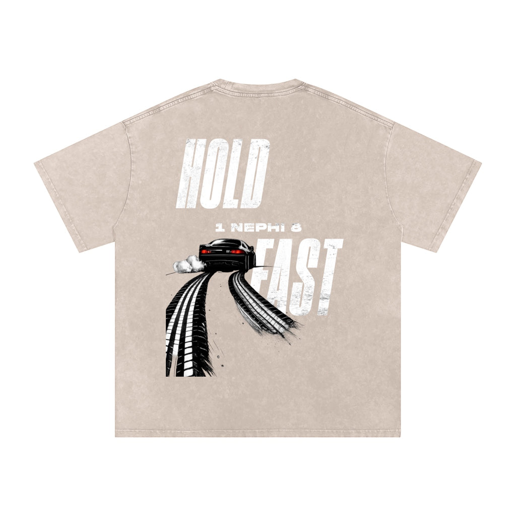 Foundation oversized washed t-shirt with a graphic of a car drifting with tire marks and the text "HOLD FAST" and "1 Nephi 8".