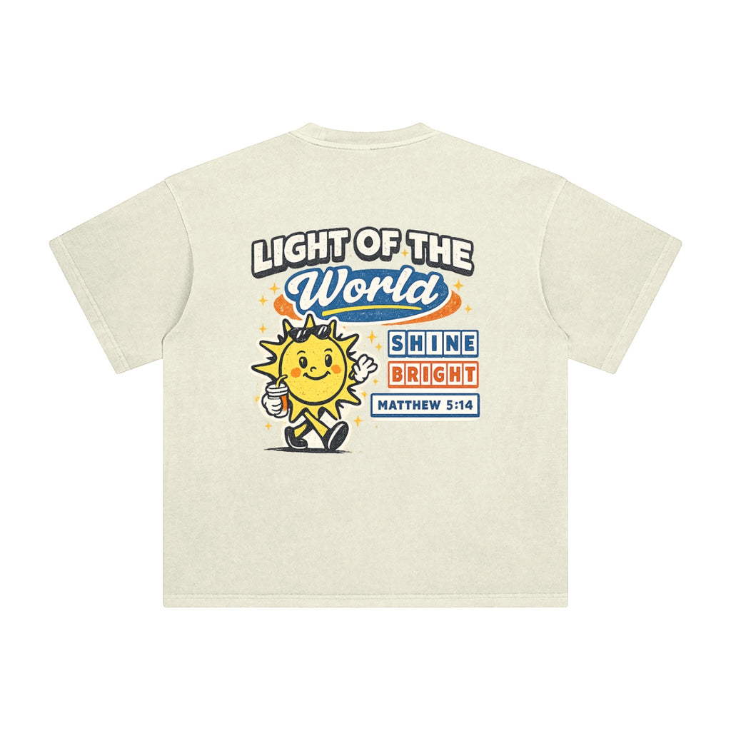 Foundation oversized t-shirt in cream, featuring a vintage wash and a graphic of a sun character with sunglasses holding a drink. Text reads "LIGHT OF THE WORLD" and "SHINE BRIGHT MATTHEW 5:14".