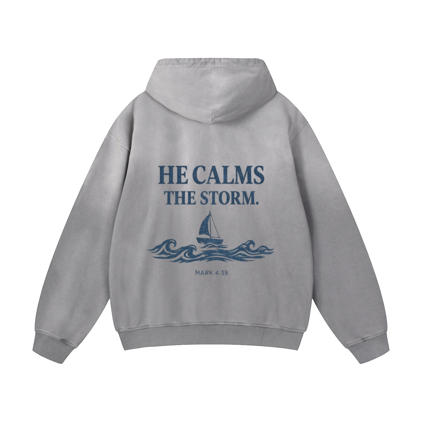 Foundation grey oversized fleece hoodie with "HE CALMS THE STORM. MARK 4:39" graphic and sailboat on waves.