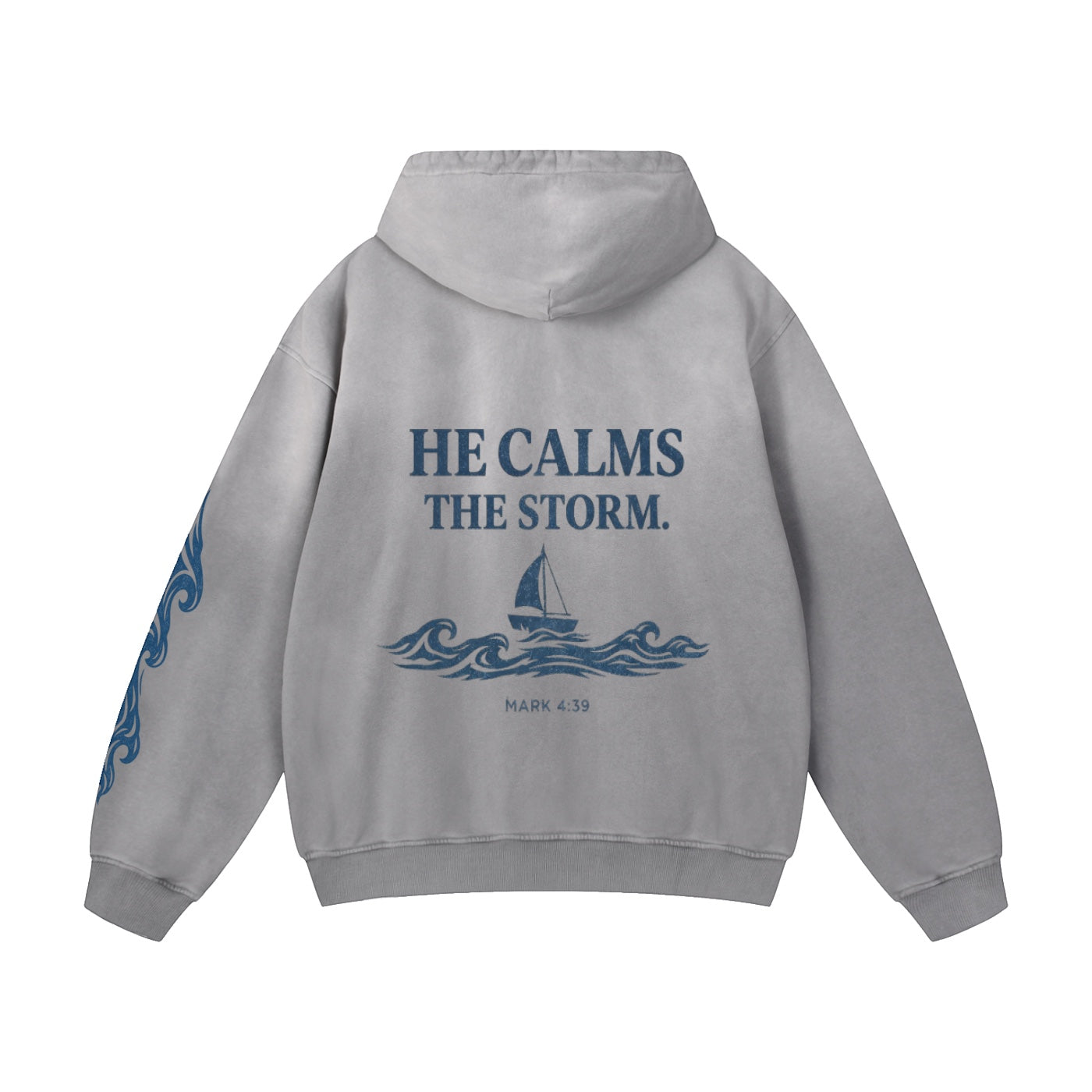 Foundation Deluxe Oversized Hoodie in grey with "HE CALMS THE STORM" graphic and sailboat on waves. Sleeve graphics.
