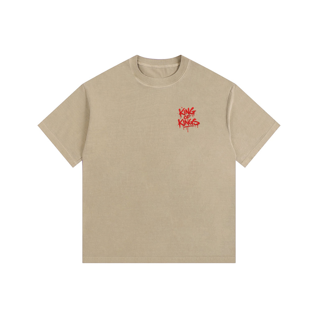 Foundation oversized washed tee in tan with red "King of Kings" graphic on front. Street-art inspired.